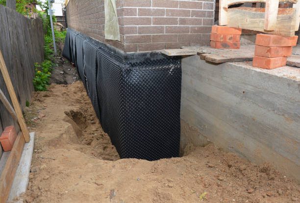 Happy homeowners after waterproofing job in Elmont